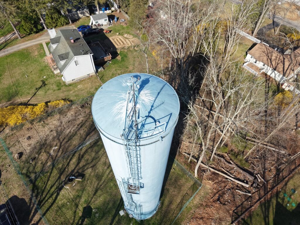 Aerial drone inspection view of a water tower in New Jersey