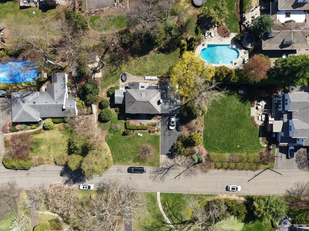 Aerial drone view of New Jersey residential properties and yards
