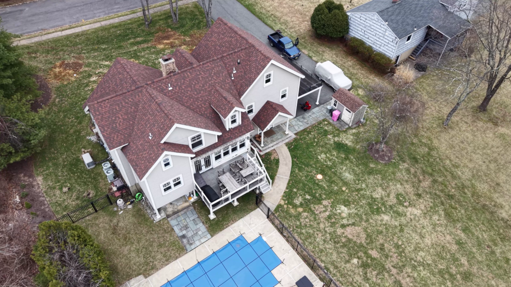 Aerial drone photo of a residential home and backyard pool in New Jersey